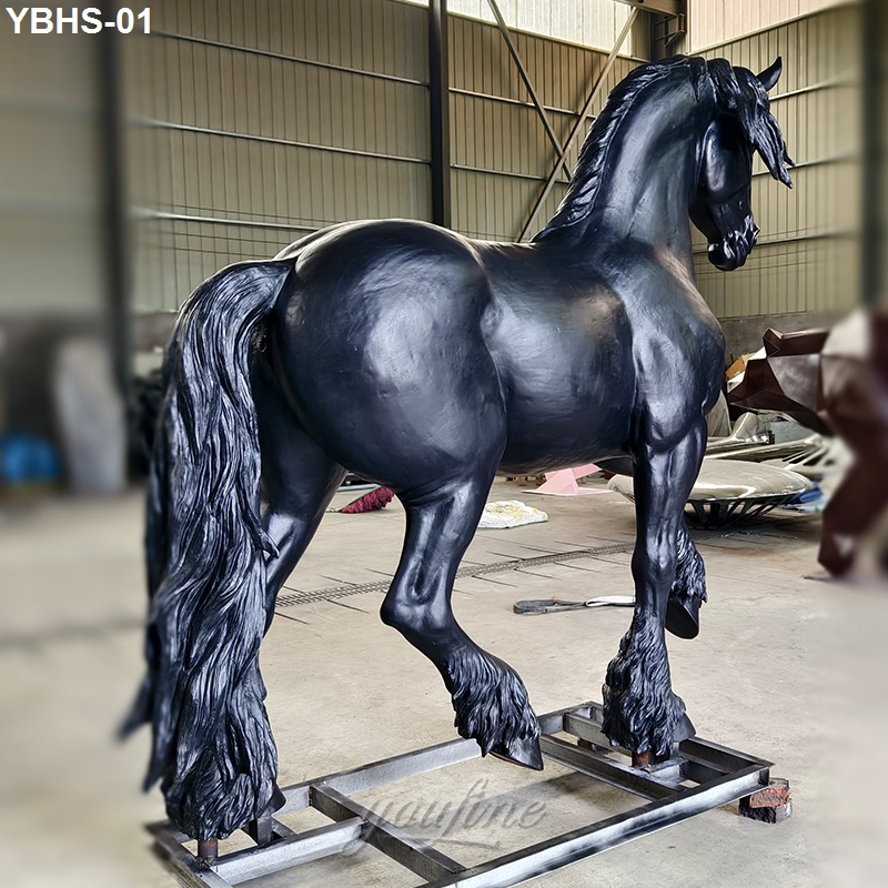 Detailed black bronze Friesian horse sculpture featuring flowing mane and tail