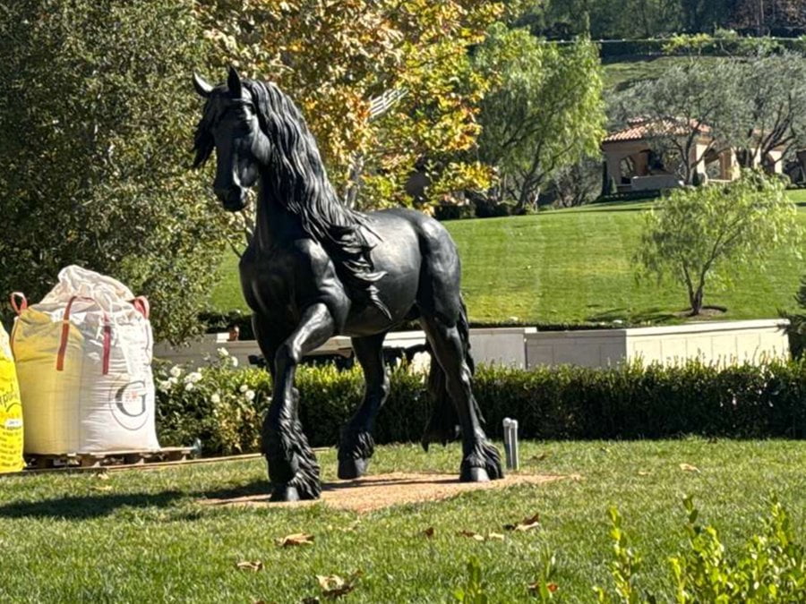 black bronze standing horse at the entrance of our ranch
