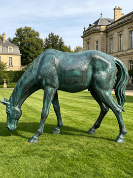 Grazing horse bronze sculpture