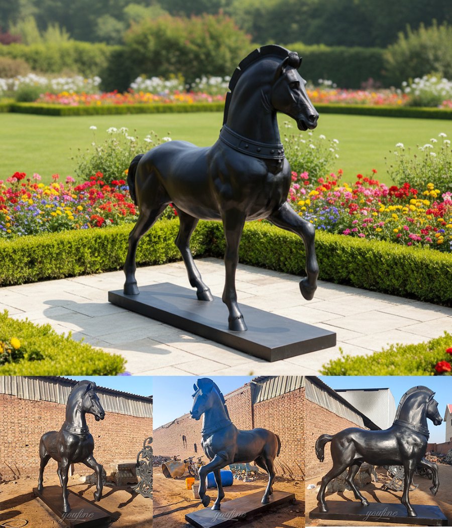 A detailed bronze horse statue with a raised hoof standing on a pedestal in a lush garden