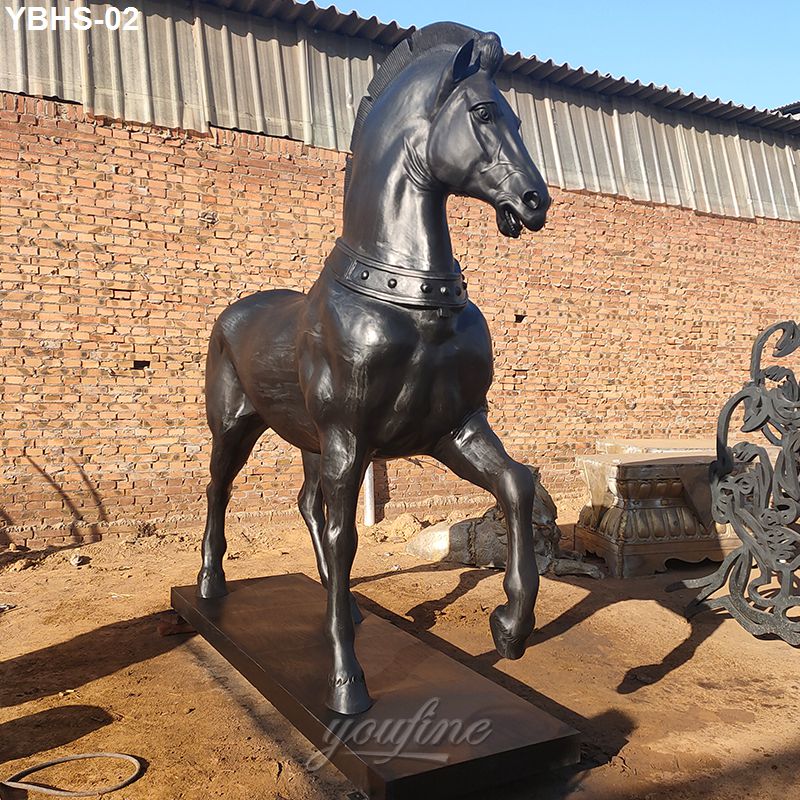 A majestic black bronze horse sculpture with intricate detailing on a rectangular base.