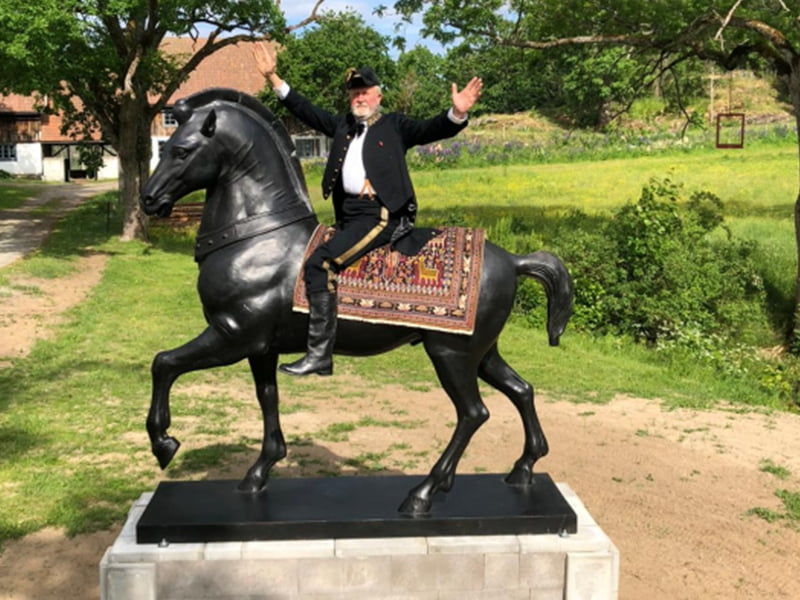 Pair of bronze eagles mounted on stone pillars at a ranch entrance in Texas