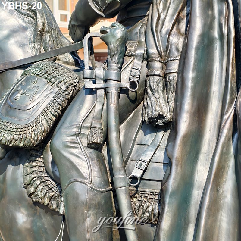 Close-up of a bronze equestrian sculpture showing intricate details of reins, sword, and saddle with ornate carvings.