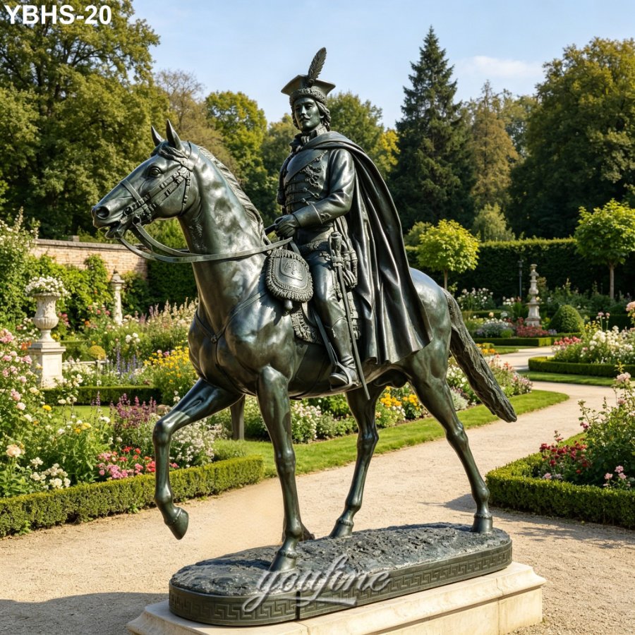 Elegant bronze statue of a uniformed rider on horseback with detailed features, displayed in a manicured formal garden setting.