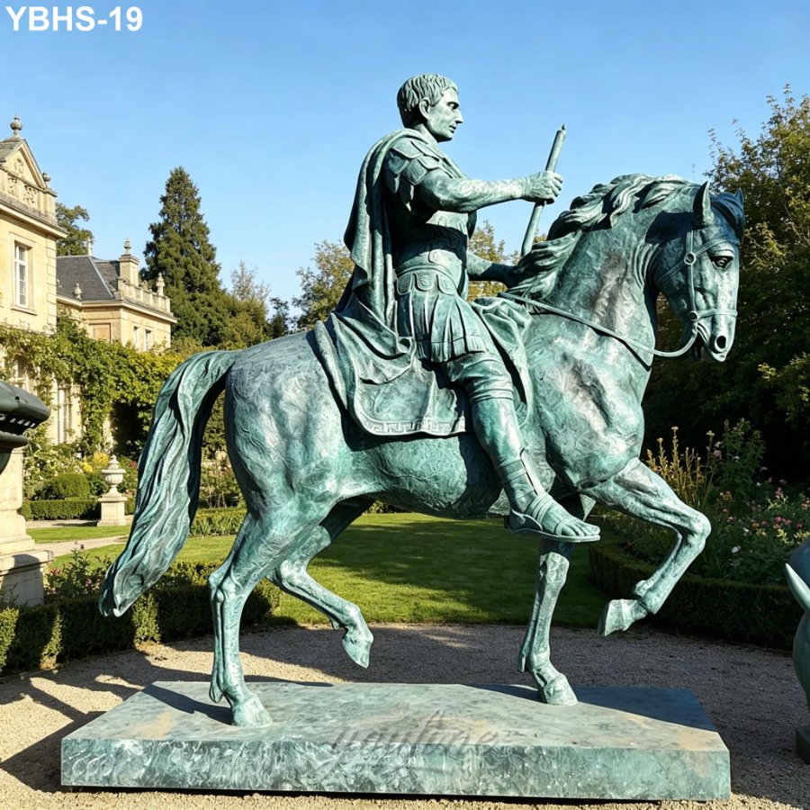A detailed bronze equestrian statue depicting a rider and horse in a dynamic pose, set in a landscaped garden near a historic mansion.
