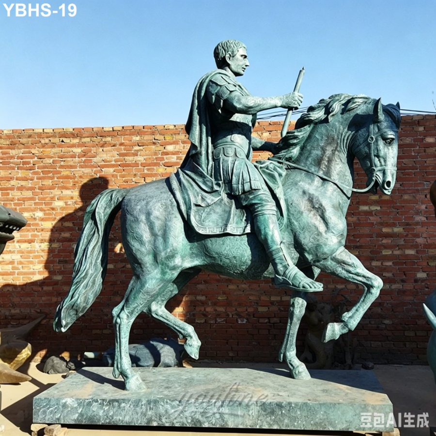 A green patina bronze equestrian statue depicting a classical warrior holding a spear, set against a brick wall under clear skies.