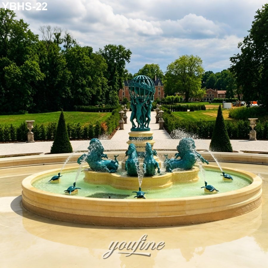 Elegant bronze fountain featuring aquatic sculptures and intricate globe design, set in a manicured castle garden with lush greenery.