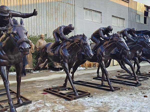 Thorough quality inspection of completed bronze rearing horse sculpture
