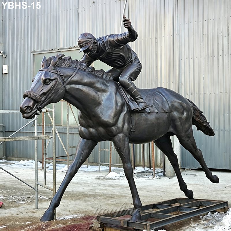 Realistic bronze statue depicting a jockey riding a galloping horse, crafted with intricate detail, against an industrial backdrop.