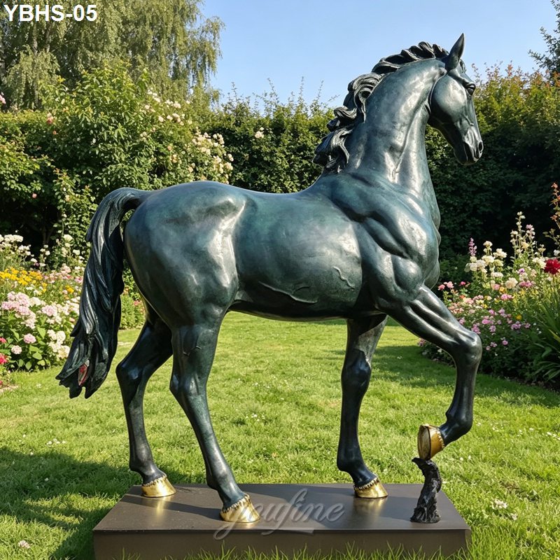 A bronze sculpture of a horse stands gracefully on the lawn, surrounded by colorful flowers and lush greenery.