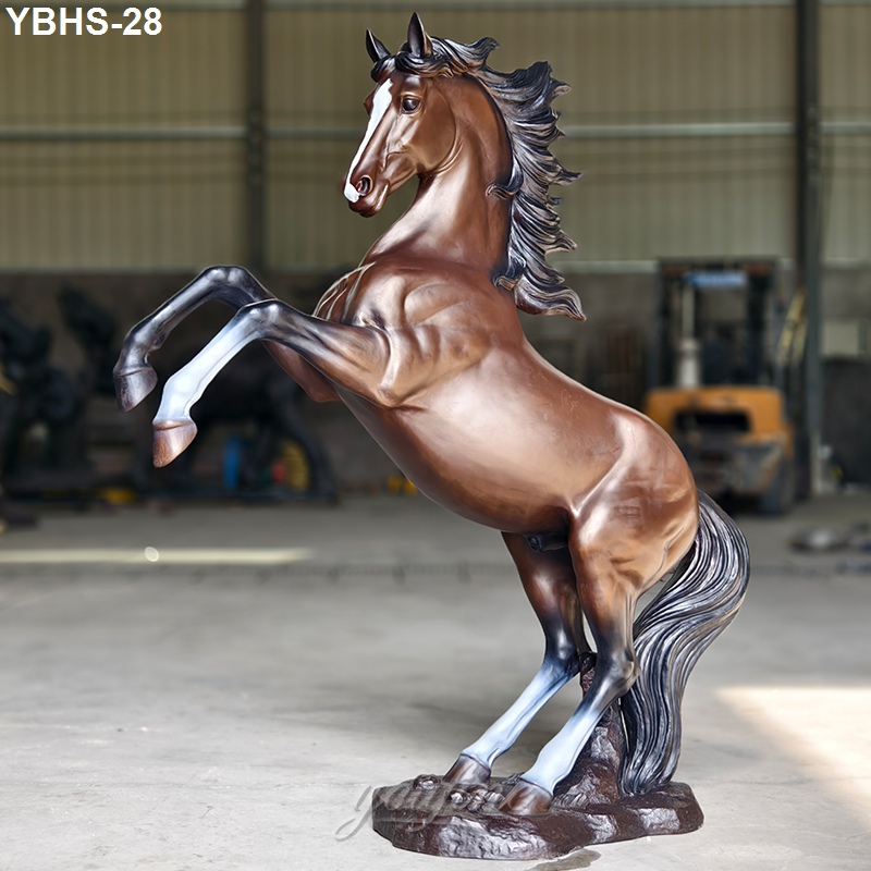 Detailed bronze sculpture of a rearing horse with dynamic posture and lifelike detailing, displayed indoors on a solid base.