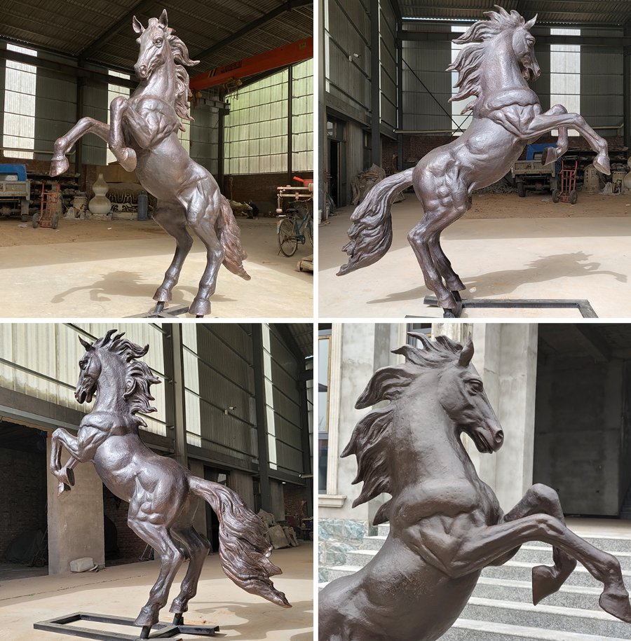A detailed bronze sculpture of a rearing horse displayed in a workshop setting, showcasing muscular anatomy and intricate craftsmanship.