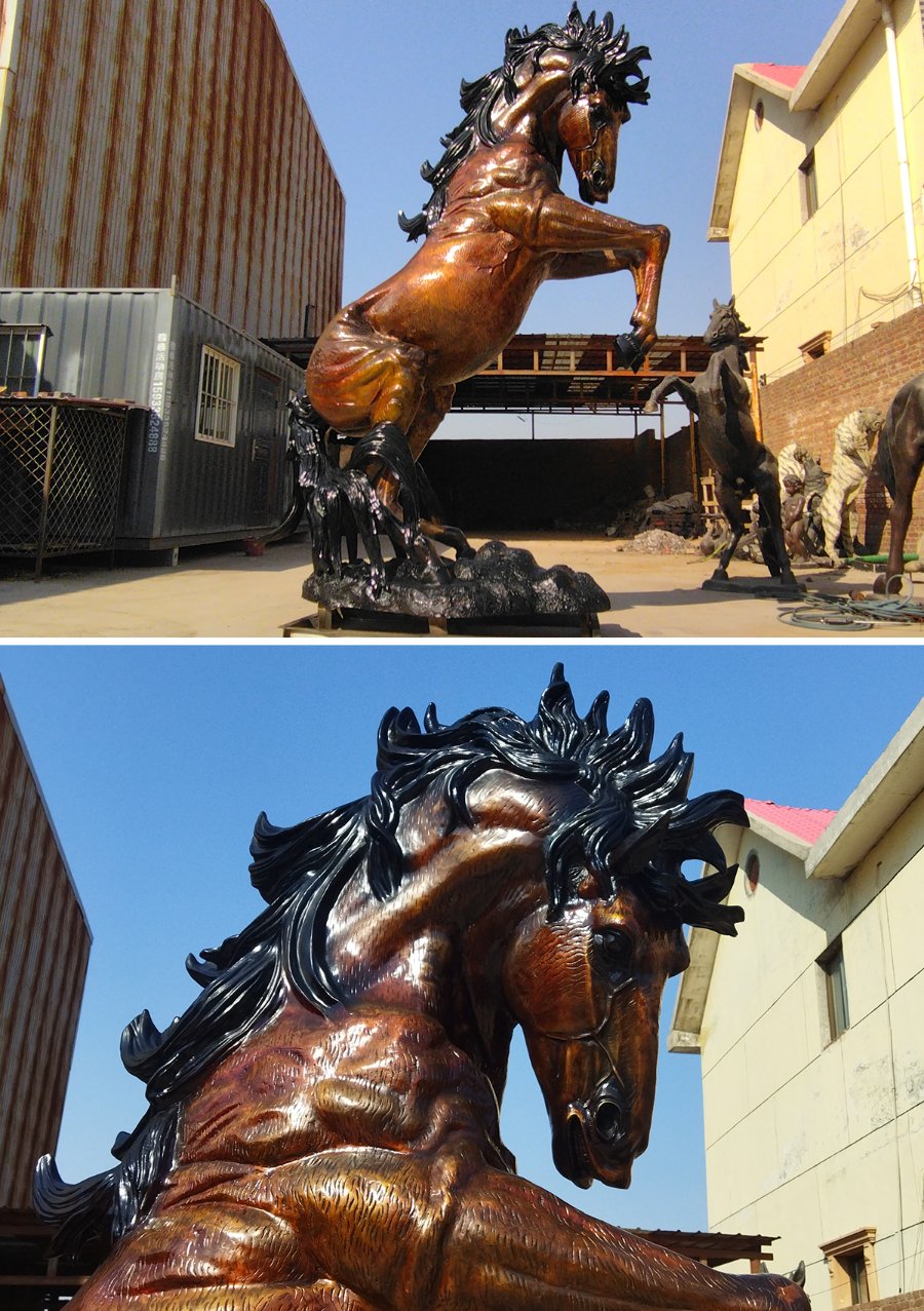 A detailed bronze horse sculpture rearing up, with striking muscular features and intricate mane details, displayed in a workshop setting.