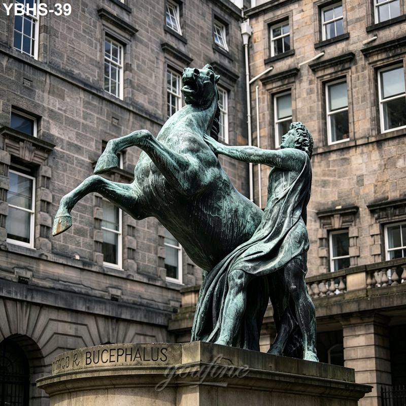 Bronze statue of Bucephalus, Alexander the Great's horse, rearing while a handler steadies it, set against a stone building façade.