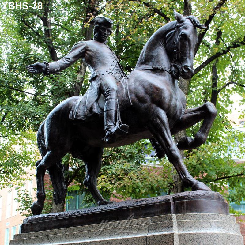 A detailed bronze equestrian statue depicting a historical figure on a rearing horse, placed on a stone pedestal amid lush park trees.