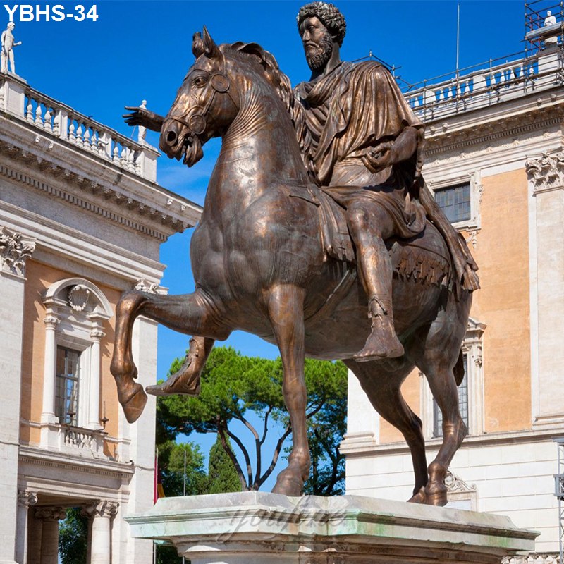 Bronze equestrian statue depicting a rider on horseback with one raised foreleg, set in an ornate plaza with sunny blue skies.