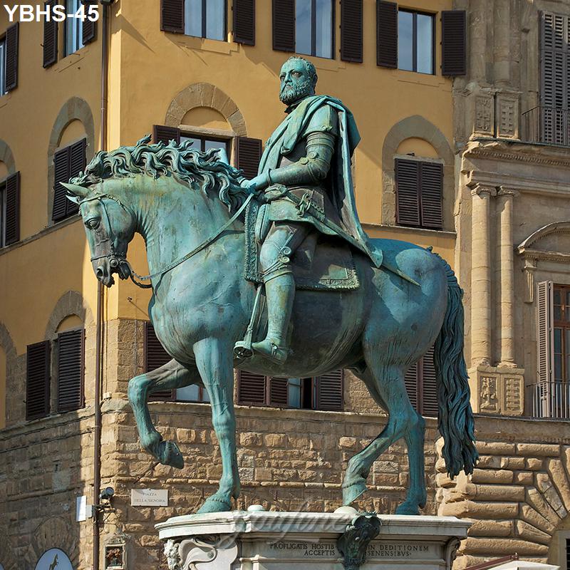 Bronze equestrian statue of a rider on a horse in a historic plaza, with classical architecture and shuttered windows in the background.