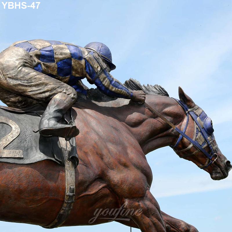 Dynamic bronze sculpture of a jockey riding a galloping horse, detailed attire and reins, set against a clear sky background.