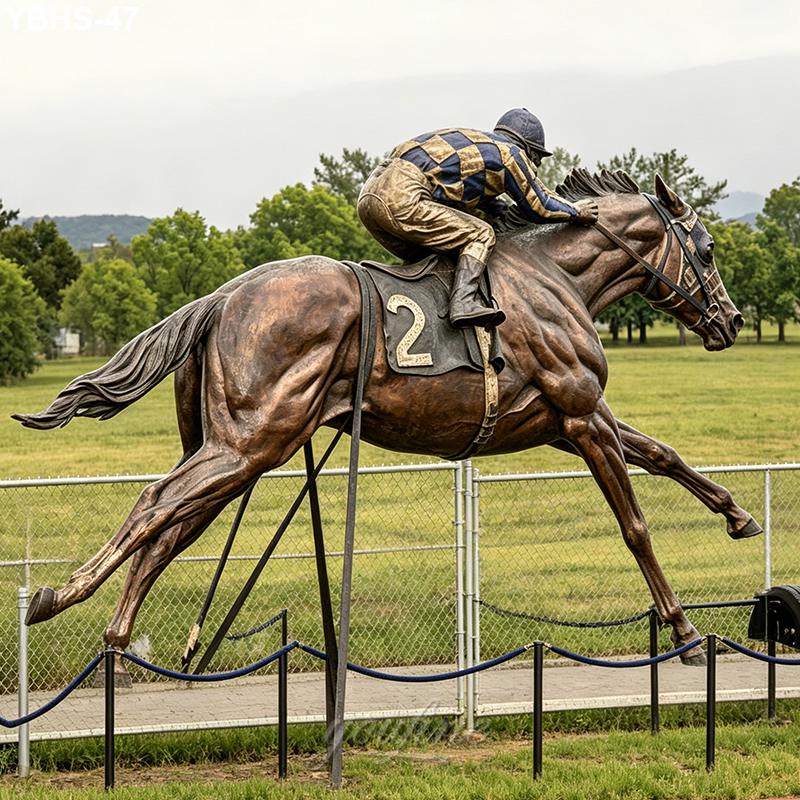 A dynamic bronze sculpture of a racehorse with a jockey wearing a striped racing uniform, positioned as if in full gallop on a track.
