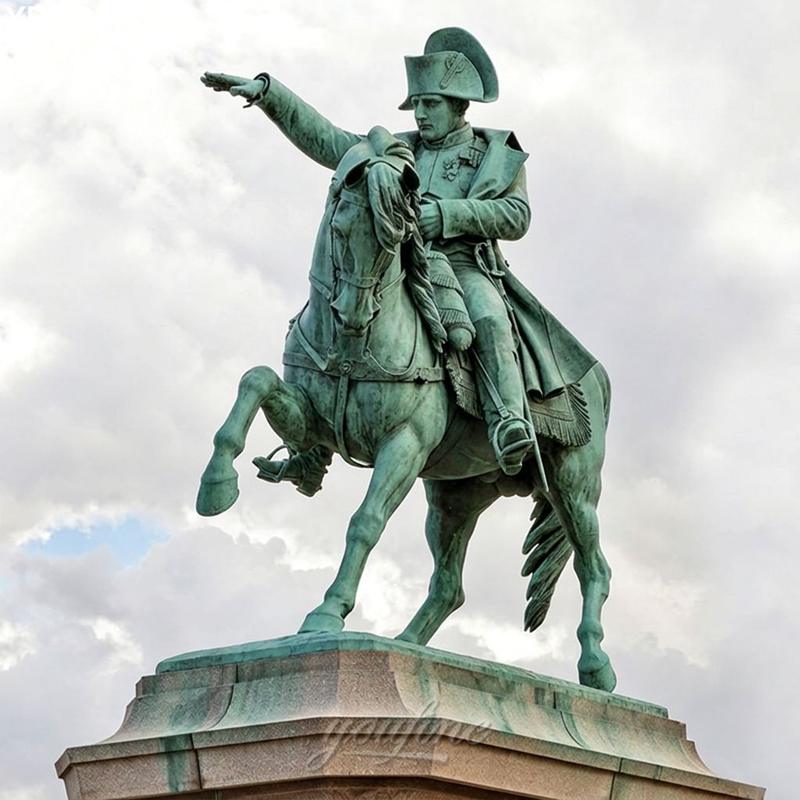 A bronze equestrian statue of a rider on horseback with arm raised, set against a cloudy sky on a stone pedestal.
