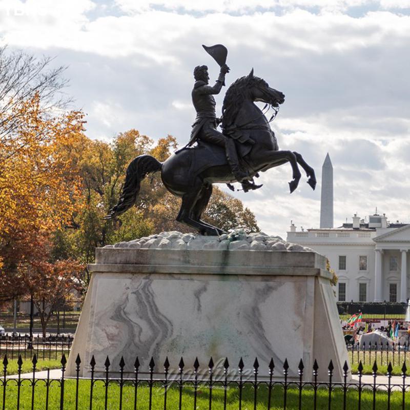 Bronze equestrian statue of Andrew Jackson raising a hat, set atop a marble pedestal with the Washington Monument and White House in the background.