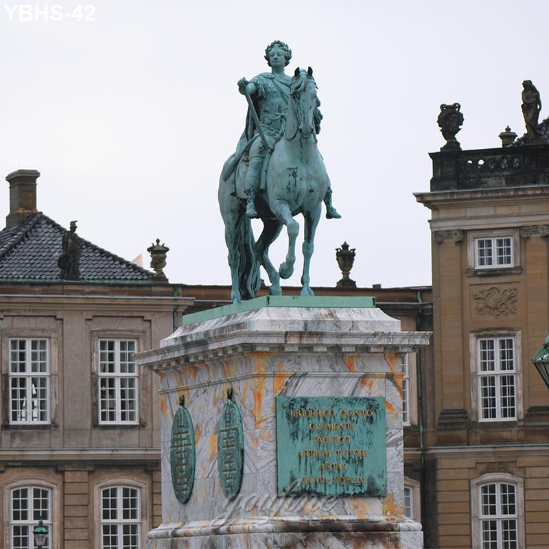 A bronze equestrian statue of a historical figure atop a marble pedestal in a European square, surrounded by classic architecture.