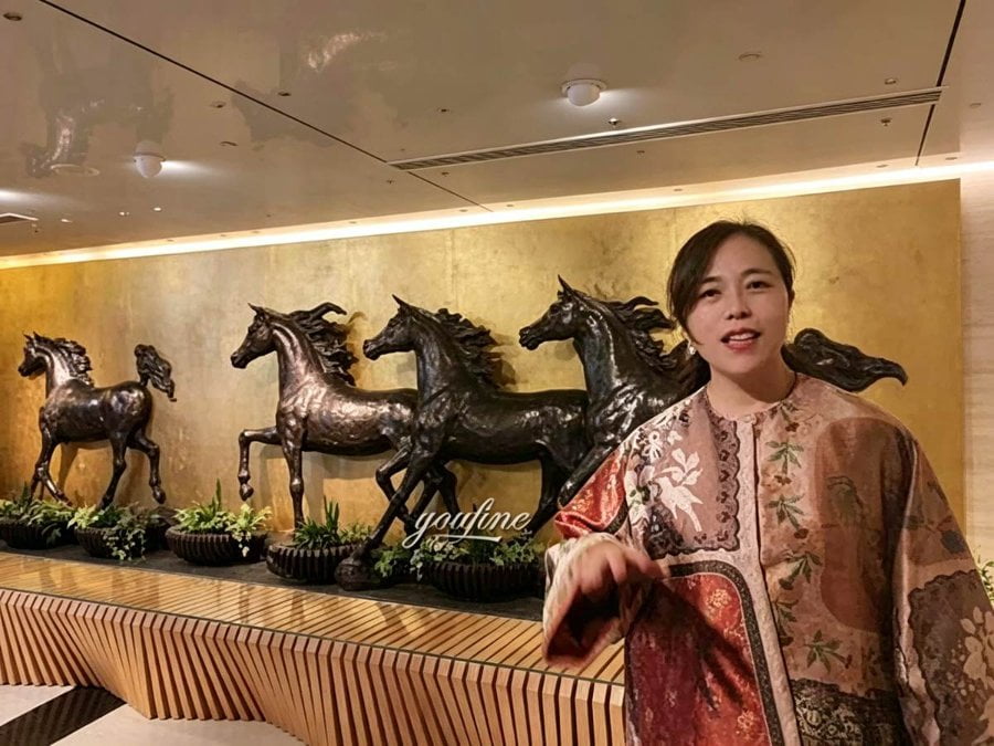 Life-size bronze galloping horse group sculpture installed at The Frame lobby, Dubai — YouFine Sculpture