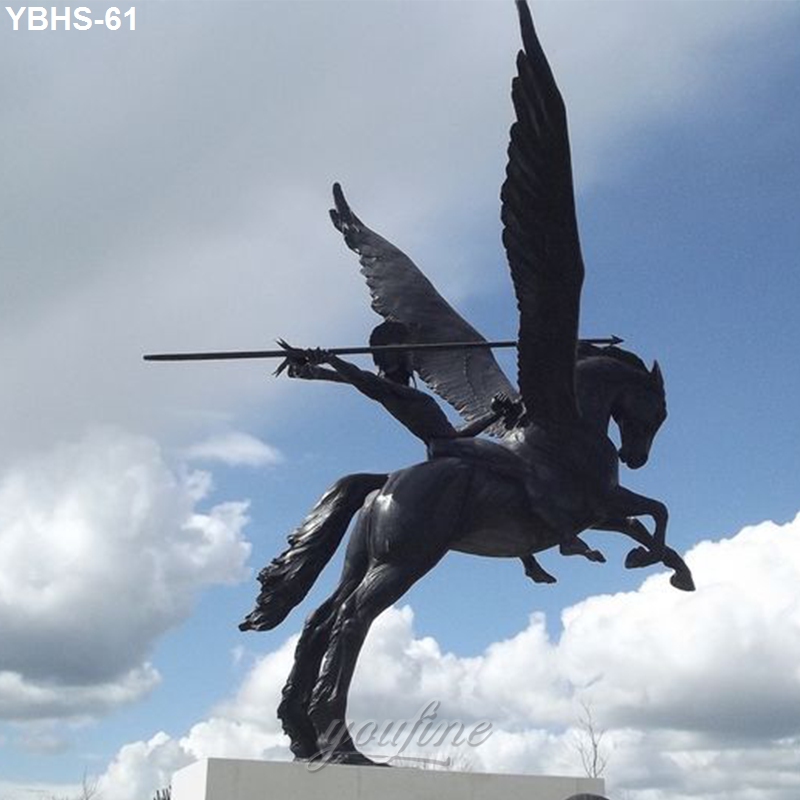A dynamic bronze statue of a winged horse and rider holding a spear, set against a background of cloudy blue sky.