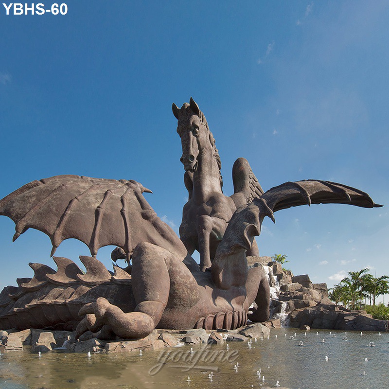 Large bronze sculpture of Pegasus rearing triumphantly over a dragon near a fountain with clear skies and surrounding greenery.