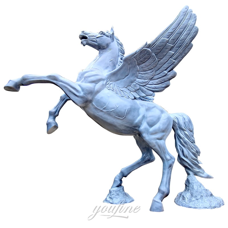 A detailed bronze sculpture of a rearing Pegasus with intricately designed wings, mounted on a rocky base.