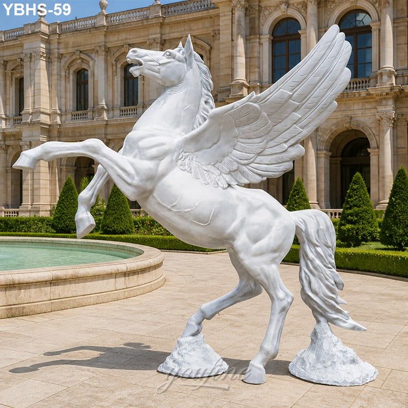 Elegant white-winged horse statue posed on stone base near a fountain, with a grand classical building and trimmed greenery in the background.